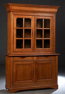 French Louis Philippe Inlaid Oak Buffet a Deux Corps, 19th c., the ogee rounded corner crown over double mullioned glazed doors, on a rounded edge bas