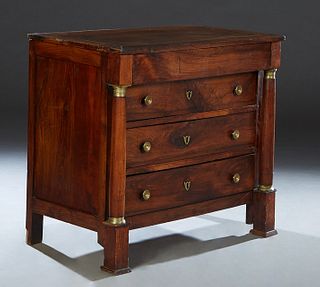 French Empire Style Ormolu Mounted Commode, c. 1840, the rectangular top over a frieze drawer and three setback drawers, flanked by tapered ormolu mou