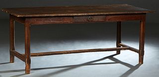 French Carved Oak Farmhouse Table, 19th c., the rectangular top over a wide skirt with one end frieze drawer and a frieze drawer on one long side, on 