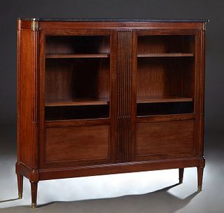 French Provincial Louis XVI Style Carved Cherry Marble Top Bookcase, 20th c., the figured black cookie corner marble over double doors with glazed upp