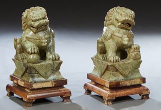 Pair of Large Chinese Carved Soapstone Foo Lions, 19th c., on a stepped giltwood base on ogee block feet, Figures- H.- 21 in., W.- 10 1/4 in., D.- 12 