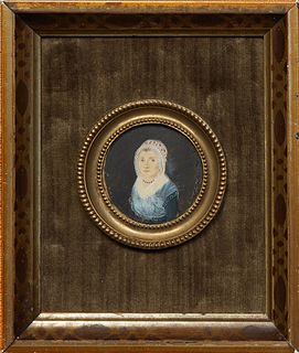 Circular Portrait Miniature of a Woman with a Lace Bonnet, 19th c., oil on board, presented in a small circular brass frame with velvet matting and a 