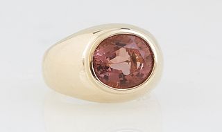 Lady's 14K Yellow Gold Dinner Ring, with an oval horizontal 4.16 ct. pink tourmaline, atop a wide tapering band, Size 6 3/4, with appraisal.