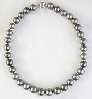 Graduated Strand of Thirty-three Gray Tahitian Cultured Pearls, ranging from 12-14mm, with a 14K white gold ball clasp, L.- 18 in., with appraisal.