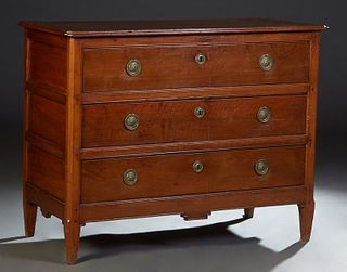 French Provincial Louis XVI Style Carved Cherry Commode, 19th c., the stepped canted corner top over three deep drawers, on tapered square legs, H.- 3