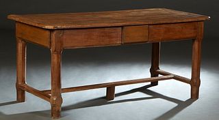 French Provincial Carved Oak Farmhouse Table. 19th c., the three board stepped canted corner top over a drawer on one end, on chamfered legs joined by