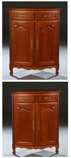Pair of French Louis XV Style Carved Cherry Corner Cabinets, 20th c., the stepped rounded edge bowed top over two frieze drawers above double convex c