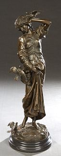 After Emile Peynot (1850-1932, French), "Young Woman and Birds," patinated bronze, impressed signature on proper left side of integral base, mounted o
