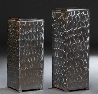 Two Brushed Steel Pedestals, 20th c., the stepped square tops over circular brushed sides, on block feet, H.- 42 1/4 in., W.- 14 in., D.-14in., and H.