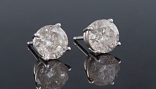 Pair of 14K White Gold Round Diamond Stud Earrings, one 1 carat; one .97 cts., total diamond wt.- 1.97 cts., with appraisal.