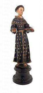 A Carved and Polychrome Decorated Santos Figure Height of figure 13 inches.