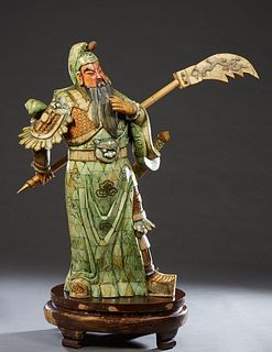 Large Japanese Polychromed Bone Clad Wood Samurai, 20th c., with a sword on his back and an axe in one hand, on an integral polychromed oval wood base