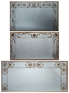 Group of Three Italian Style Gilt and Eglomise Overmantel Mirrors, 20th c., each with painted leaf and scroll borders, Two H.- 41 1/4 in., W.- 79 in.,
