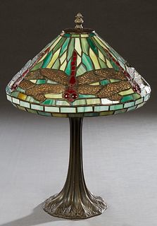 Tiffany Style Leaded Glass Lamp, 20th/21st c., the leaded glass dragonfly shade with copper overlay, on a patinated brass reeded support to a circular