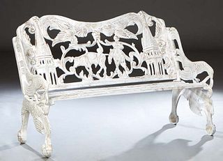 Cast Aluminum Garden Bench, 20th/21st c., the pierced serpentine back with figural and steeple decorations, flanked by bird form arms, joined by a sla
