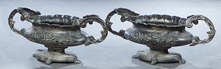 Pair of Cast Aluminium Oval Planters, 20th/21st c., the sides with relief rose decoration, on an oval base on four paw feet, H.- 13 1/2 in., W.- 31 in