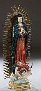 Polychrome Cast Metal Virgin of Guadalupe Statue, 20th/21st c., backed by "rays," on a horned winged angel stepped octagonal base, H.- 58 in., W.- 24 