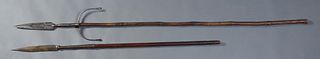 Two Silvered Iron Persian Pikes, 19th c., one with an engraved tip over a curved hand stop, on a bamboo shaft, the other with an iron pointed tip on a