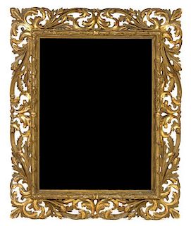 * An Italian Giltwood Mirror Height 42 1/2 x width 34 inches.