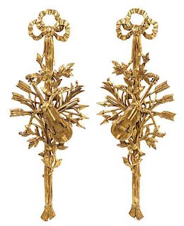 A Pair of Italian Giltwood Wall Ornaments Height 48 inches.