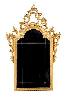 An Italian Baroque Style Giltwood Mirror Height 46 inches.