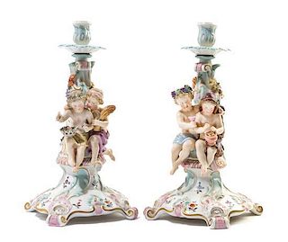 * A Pair of Continetal Porcelain Figural Candlesticks Height 12 1/2 inches.