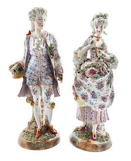 * A Pair of German Porcelain Figures Height 19 1/4 inches.