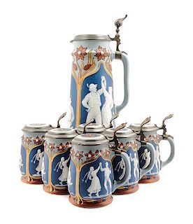 * A Mettlach Pewter Mounted Stein Set Height of first 14 1/2 inches.