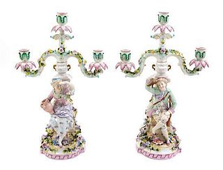 A Pair of Continental Porcelain Three-Light Figural Candelabra Width of candelabra arms 11 1/2 inches.