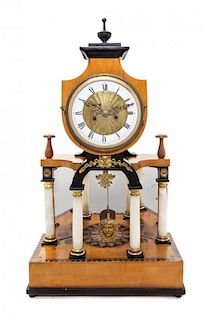 * A Biedermeier Parcel Ebonized Onyx Mounted Fruitwood Mantel Clock Height 24 inches.
