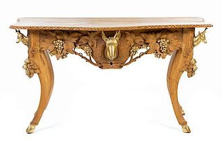 A Black Forest Style Parcel Gilt Fruitwood Console Table
