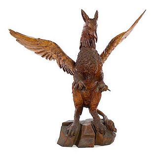 A Continental Carved Griffin Height 42 1/2 inches.