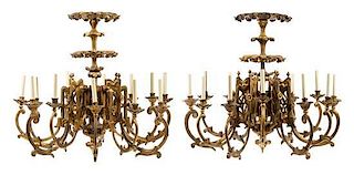 A Pair of Gothic Revival Giltwood Twelve-Light Chandeliers Height 33 x diameter 36 inches.