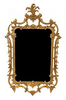 * A George III Style Giltwood Mirror Height 49 x width 29 inches.