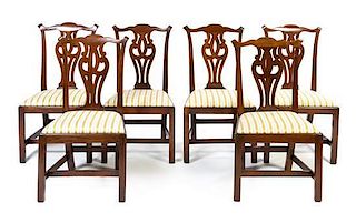 A Set of Six Chippendale Style Mahogany Dining Chairs Height 37 1/2 inches.