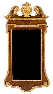 A George III Style Parcel Gilt Mahogany Mirror Height 48 1/2 x width 24 3/4 inches.