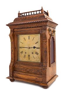 A Victorian Oak Bracket Clock Height of clock 22 x width 13 3/4 x depth 9 inches.