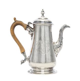 A George II Silver Coffee Pot, Isaac Cookson, Newcastle, 1752, of baluster form surmounted by a stepped cover with an acorn fini