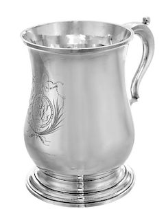 A George II Silver Tankard, Mark of Robert Albin Cox, London, 1758, of baluster form and raised on a stepped circular base, the
