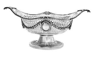 * An English Silver Basket, Elkington & Co., London, 1906, having reticulated sides and festoon decoration.