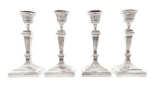 * A Set Four English Silver Candlesticks, William Hutton & Sons, London, 1923-1924, each of squared baluster form, weighted.