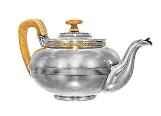 * A Russian Silver Teapot, Carl Gustaf Savary, St. Petersburg, Early 19th century, of low form with gilt foliate band and ringed
