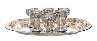 * An Assembled German Silver Drink Set, Schmedding, Augsburg, 19th/20th Century, comprising six cordials and a tray; seven items