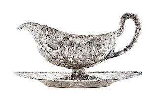* An American Silver Sauce and Underplate, Loring Andrews, Cincinnati, 19th Century, of handled footed form, decorated with a ca