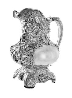 * An American Art Nouveau Silver Water Pitcher, Phelps and Cary Co., New York, NY, Circa 1900, of handled form with floral repou