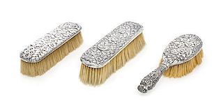 Three American Silver Brushes, Various Makers, comprising a Tiffany & Co. Repousse hairbrush, together with a similarly decorate