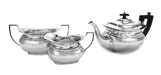 * A George VI Silver Tea Service, W. Neale & Son Ltd., Birmingham, 1946, comprising a tea pot, creamer and sugar.