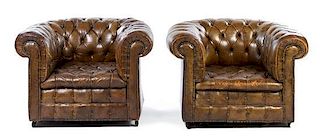 A Pair of Leather Upholstered Chesterfield Club Chairs Height 27 x width 42 x depth 37 inches.