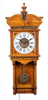 An Ansonia Oak Wall Clock Height 42 1/2 inches.
