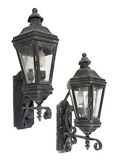 A Set of Four Cast Metal Lanterns Height 22 1/2 x depth 11 3/8 inches.
